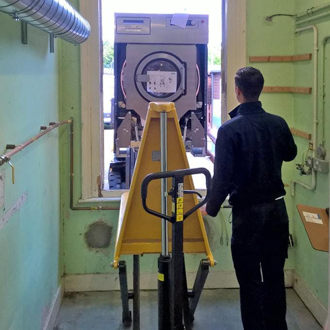 Engineer unloading Miele Professional Equipment